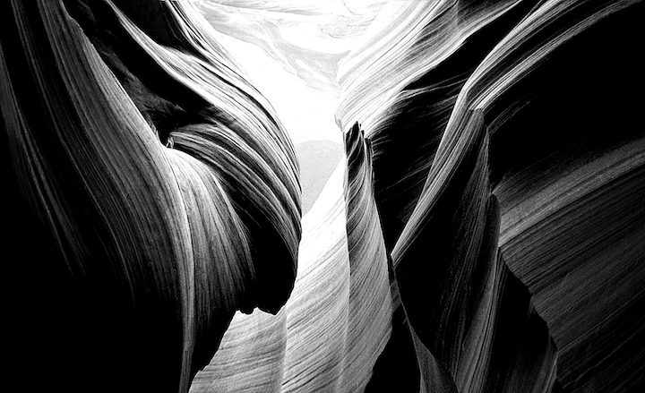 A black and white photo of the bottom part of a canyon.